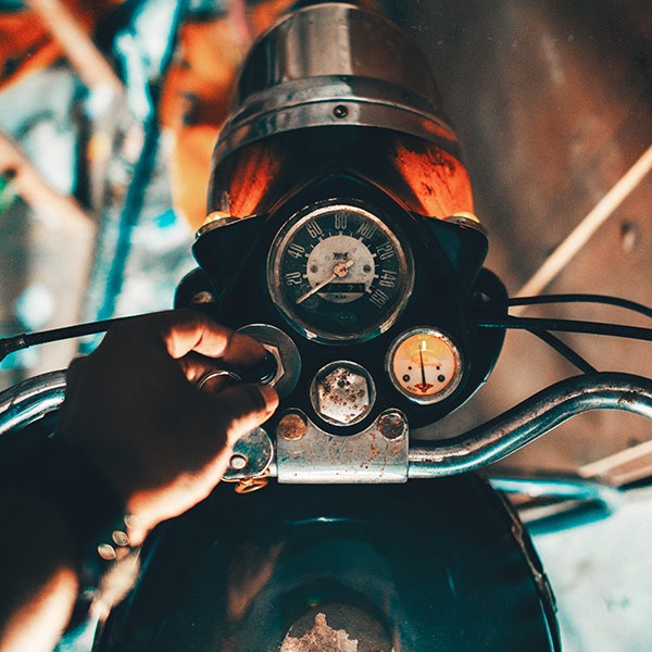 Switching a vintage Royal Enfield bullet 350 on in Trivandrum, Kerala, India